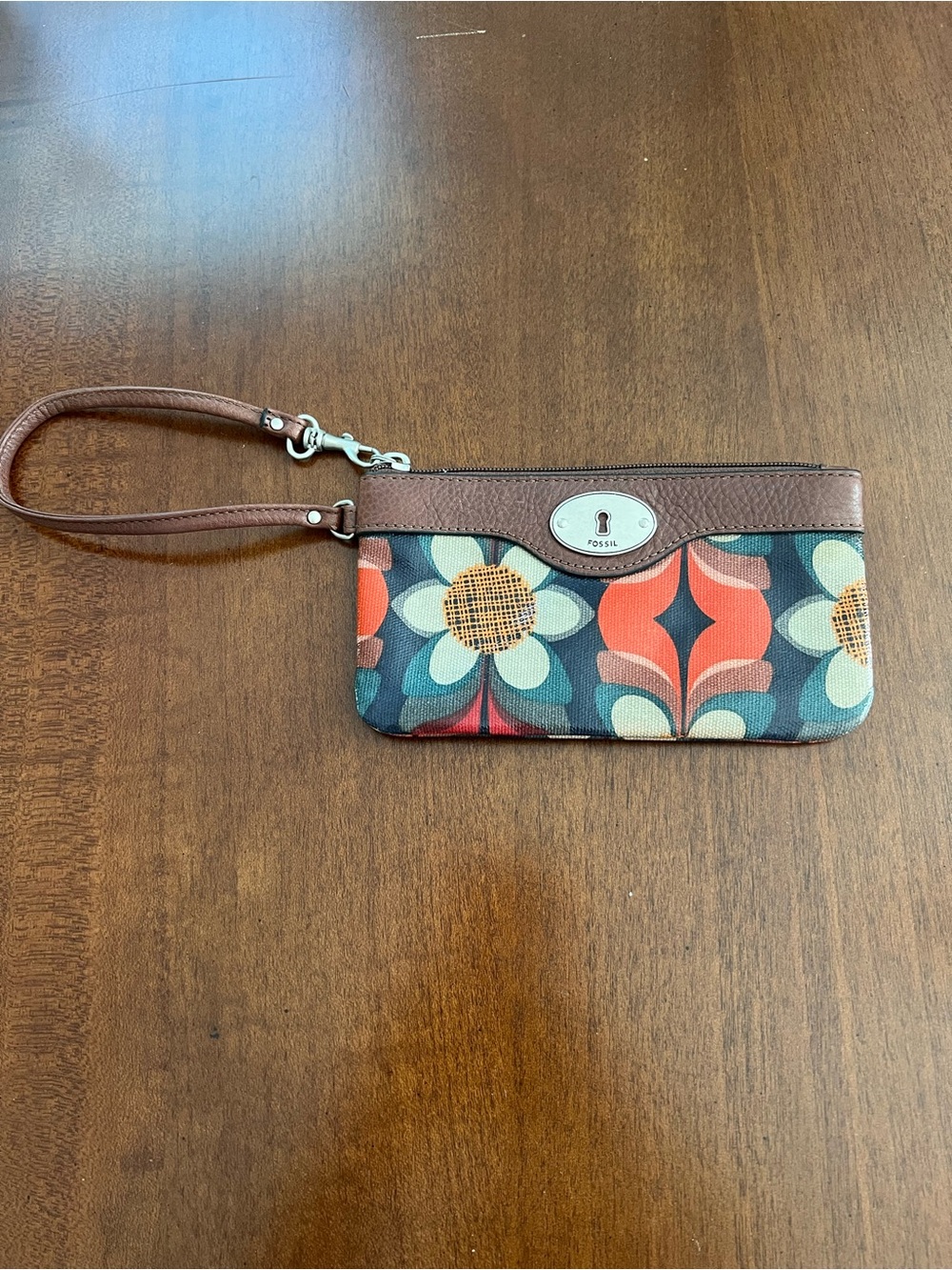 Fossil Brown Floral Wristlet with Orange and Blue Accents